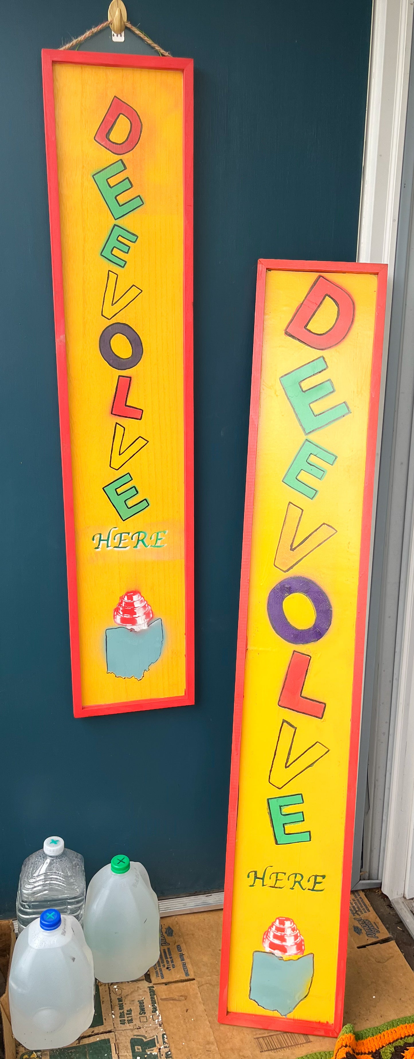 Devo “DeEvolve Here” Porch Decor Sign